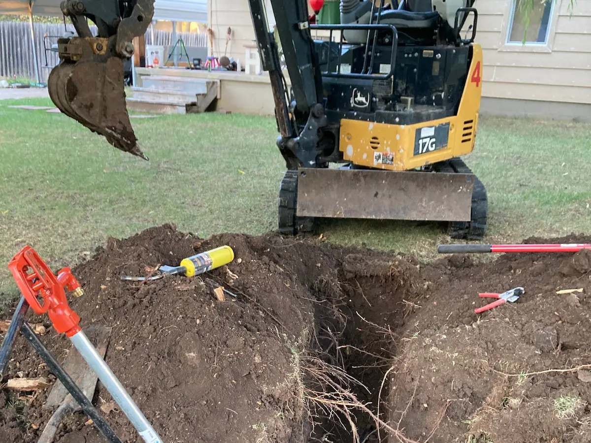 New frost-proof yard hydrant installed beside a Butler County outbuilding