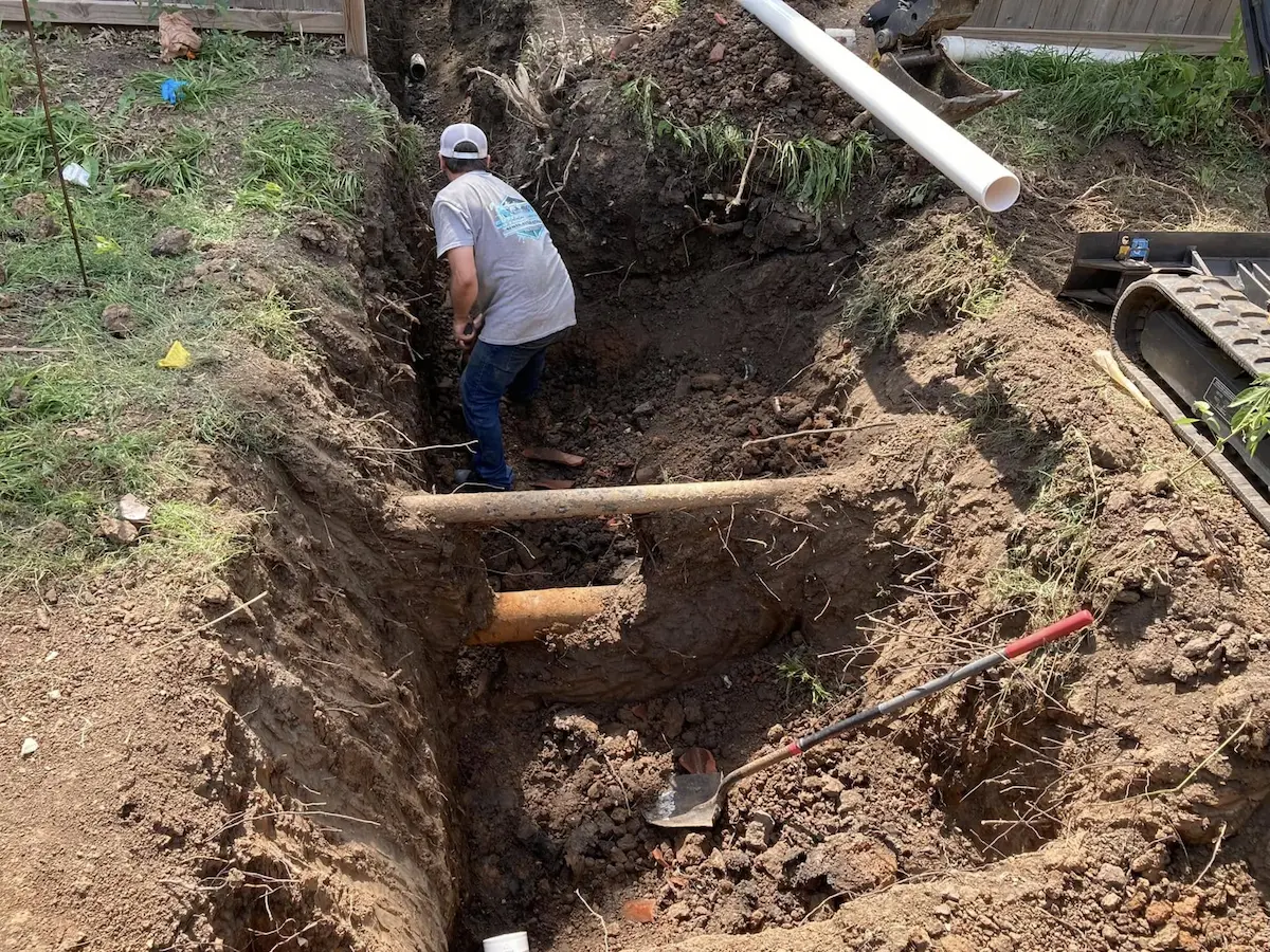 Deep trench for full sewer line replacement near El Dorado, KS
